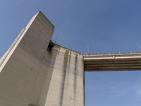 Visible banks, dry soil, and uncultivated vegetation replace the water at Lake Monte Cotugno, a reservoir in Basilicata, which in the summer...