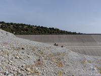 Visible banks, dry soil, and uncultivated vegetation replace the water at Lake Monte Cotugno, a reservoir in Basilicata, which in the summer...