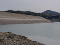 Visible banks, dry soil, and uncultivated vegetation replace the water at Lake Monte Cotugno, a reservoir in Basilicata, which in the summer...