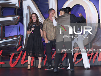 Tom Hardy, Kelly Marcel, and Cristo Fernandez attend the black carpet fan event for Venom: The Last Dance at Toreo Parque Central in Mexico...