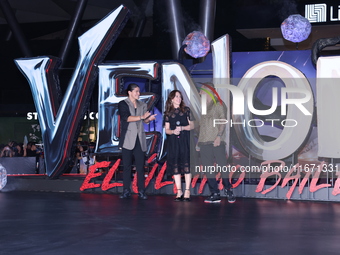 Tom Hardy, Kelly Marcel, and Cristo Fernandez attend the black carpet fan event for Venom: The Last Dance at Toreo Parque Central in Mexico...