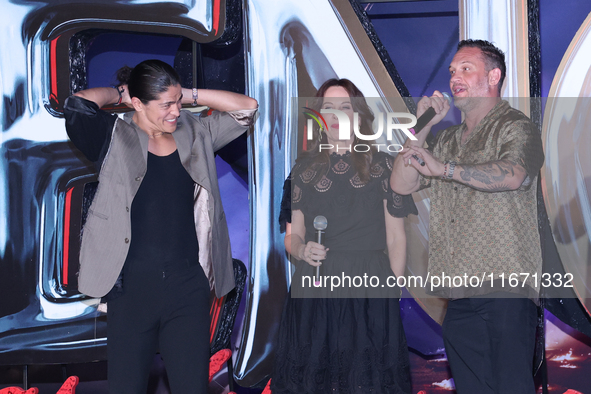 Tom Hardy, Kelly Marcel, and Cristo Fernandez attend the black carpet fan event for Venom: The Last Dance at Toreo Parque Central in Mexico...