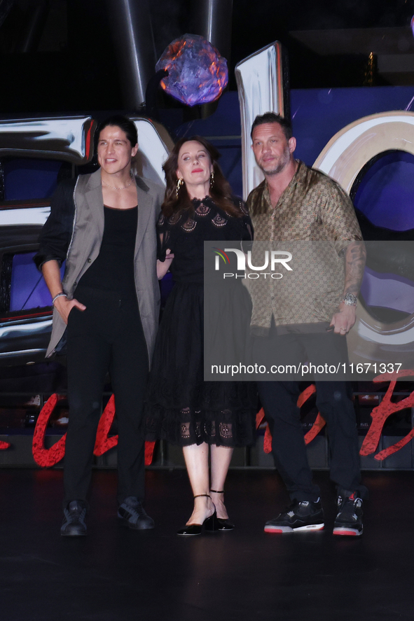 Tom Hardy, Kelly Marcel, and Cristo Fernandez attend the black carpet fan event for Venom: The Last Dance at Toreo Parque Central in Mexico...