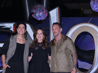 Tom Hardy, Kelly Marcel, and Cristo Fernandez attend the black carpet fan event for Venom: The Last Dance at Toreo Parque Central in Mexico...