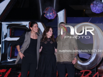 Tom Hardy, Kelly Marcel, and Cristo Fernandez attend the black carpet fan event for Venom: The Last Dance at Toreo Parque Central in Mexico...