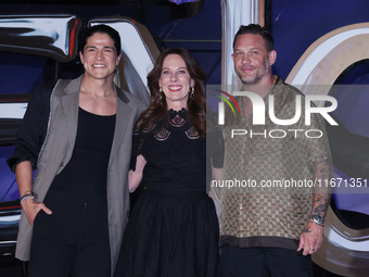 Tom Hardy, Kelly Marcel, and Cristo Fernandez attend the black carpet fan event for Venom: The Last Dance at Toreo Parque Central in Mexico...