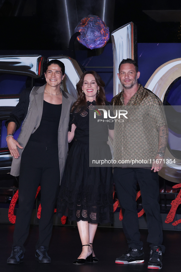 Tom Hardy, Kelly Marcel, and Cristo Fernandez attend the black carpet fan event for Venom: The Last Dance at Toreo Parque Central in Mexico...