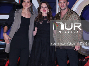 Tom Hardy, Kelly Marcel, and Cristo Fernandez attend the black carpet fan event for Venom: The Last Dance at Toreo Parque Central in Mexico...