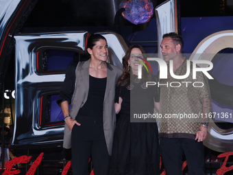 Tom Hardy, Kelly Marcel, and Cristo Fernandez attend the black carpet fan event for Venom: The Last Dance at Toreo Parque Central in Mexico...