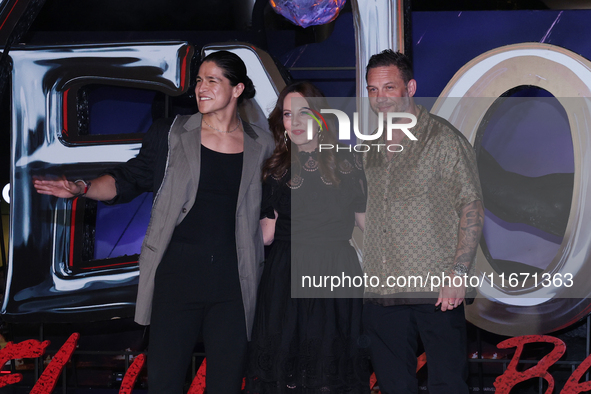 Tom Hardy, Kelly Marcel, and Cristo Fernandez attend the black carpet fan event for Venom: The Last Dance at Toreo Parque Central in Mexico...