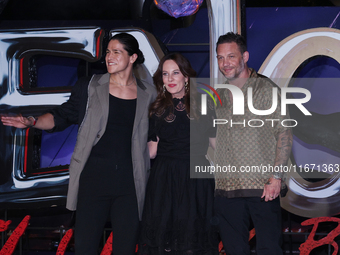 Tom Hardy, Kelly Marcel, and Cristo Fernandez attend the black carpet fan event for Venom: The Last Dance at Toreo Parque Central in Mexico...