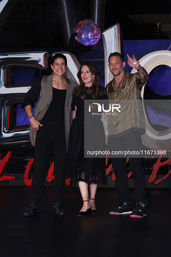 Tom Hardy, Kelly Marcel, and Cristo Fernandez attend the black carpet fan event for Venom: The Last Dance at Toreo Parque Central in Mexico...