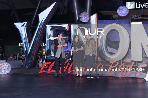 Tom Hardy, Kelly Marcel, and Cristo Fernandez attend the black carpet fan event for Venom: The Last Dance at Toreo Parque Central in Mexico...