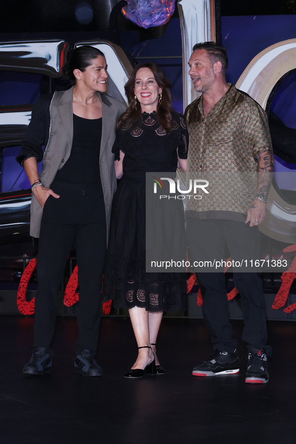 Tom Hardy, Kelly Marcel, and Cristo Fernandez attend the black carpet fan event for Venom: The Last Dance at Toreo Parque Central in Mexico...