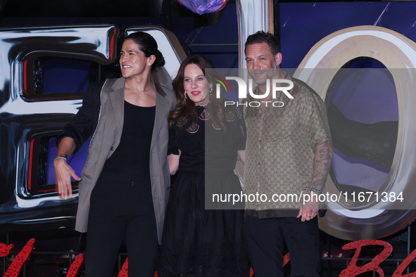 Tom Hardy, Kelly Marcel, and Cristo Fernandez attend the black carpet fan event for Venom: The Last Dance at Toreo Parque Central in Mexico...