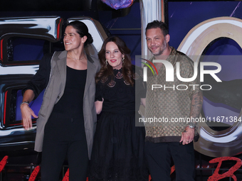 Tom Hardy, Kelly Marcel, and Cristo Fernandez attend the black carpet fan event for Venom: The Last Dance at Toreo Parque Central in Mexico...