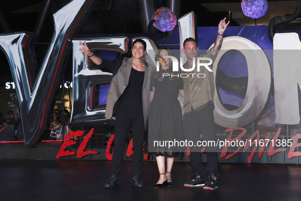 Tom Hardy, Kelly Marcel, and Cristo Fernandez attend the black carpet fan event for Venom: The Last Dance at Toreo Parque Central in Mexico...