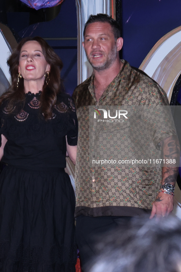 Tom Hardy and Kelly Marcel attend the black carpet fan event for Venom: The Last Dance at Toreo Parque Central in Mexico City, Mexico, on Oc...