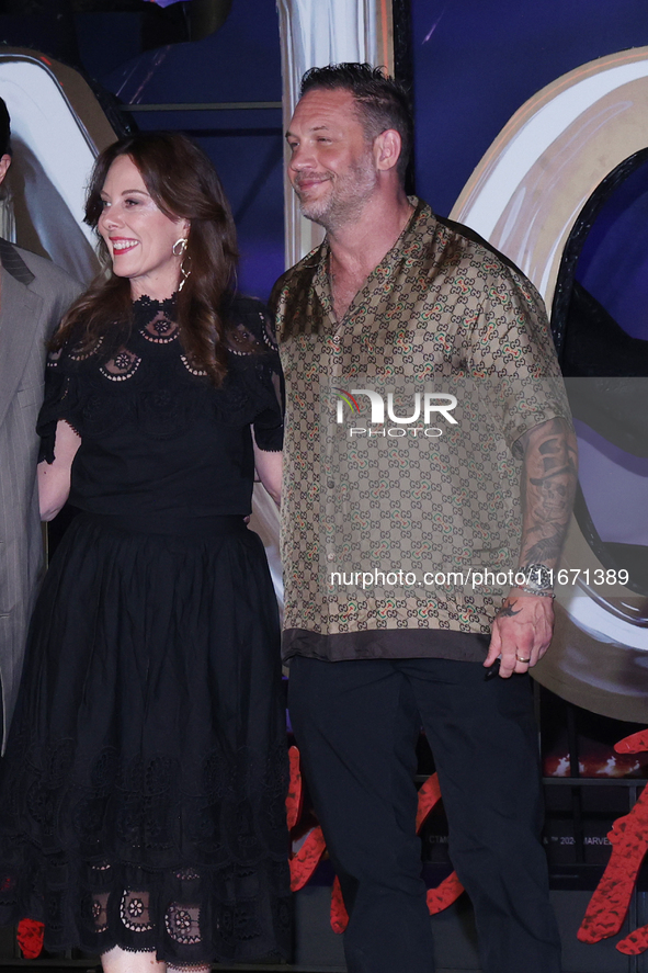 Tom Hardy and Kelly Marcel attend the black carpet fan event for Venom: The Last Dance at Toreo Parque Central in Mexico City, Mexico, on Oc...