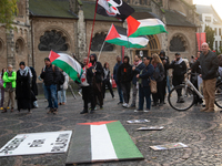 Dozens of pro-Palestinian activists gather at Muenster Square and protest against Israeli airstrike in Bonn, Germany, on October 16, 2024. (