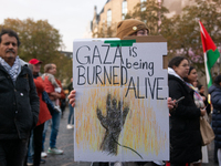 Dozens of pro-Palestinian activists gather at Muenster Square and protest against Israeli airstrike in Bonn, Germany, on October 16, 2024. (