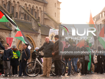 Dozens of pro-Palestinian activists gather at Muenster Square and protest against Israeli airstrike in Bonn, Germany, on October 16, 2024. (