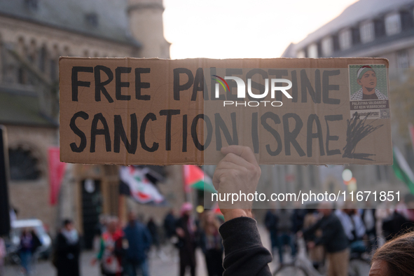 Dozens of pro-Palestinian activists gather at Muenster Square and protest against Israeli airstrike in Bonn, Germany, on October 16, 2024. 