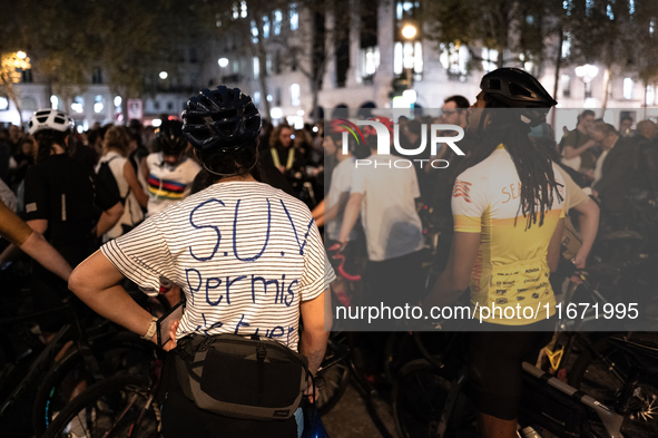 A cyclist wears a T-shirt that reads ''SUV licence to kill'' during a gathering to pay tribute to Paul, 27, a cyclist who was run over two d...