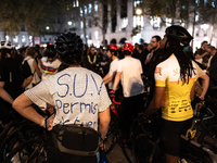 A cyclist wears a T-shirt that reads ''SUV licence to kill'' during a gathering to pay tribute to Paul, 27, a cyclist who was run over two d...