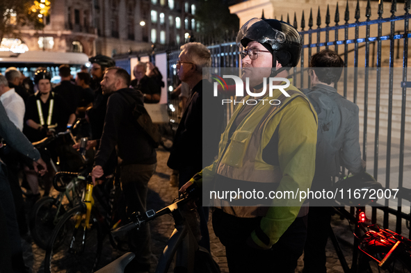 People gather to pay tribute to Paul, 27, a cyclist who is run over by a car in Paris following a dispute, at Place de la Madeleine with the...