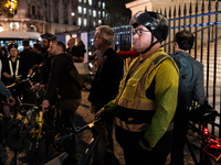 People gather to pay tribute to Paul, 27, a cyclist who is run over by a car in Paris following a dispute, at Place de la Madeleine with the...