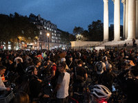 People gather to pay tribute to Paul, 27, a cyclist who is run over by a car in Paris following a dispute, at Place de la Madeleine with the...