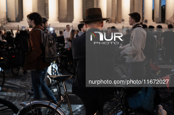 People gather to pay tribute to Paul, 27, a cyclist who is run over by a car in Paris following a dispute, at Place de la Madeleine with the...