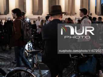 People gather to pay tribute to Paul, 27, a cyclist who is run over by a car in Paris following a dispute, at Place de la Madeleine with the...