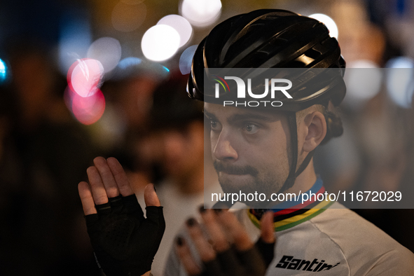 People gather to pay tribute to Paul, 27, a cyclist who is run over by a car in Paris following a dispute, at Place de la Madeleine with the...