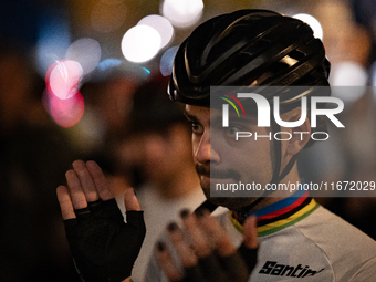 People gather to pay tribute to Paul, 27, a cyclist who is run over by a car in Paris following a dispute, at Place de la Madeleine with the...