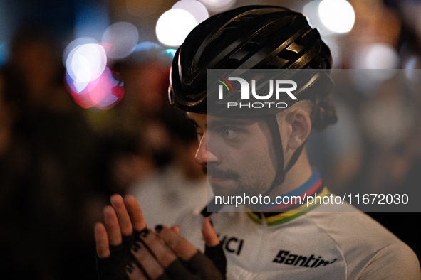 People gather to pay tribute to Paul, 27, a cyclist who is run over by a car in Paris following a dispute, at Place de la Madeleine with the...