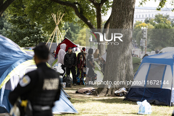 In Washington, DC, on October 14, an Indian tribe from San Francisco rides on horses and makes it to the National Mall, where they have been...