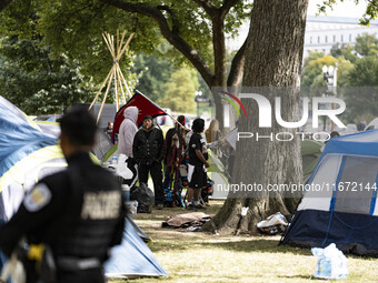 In Washington, DC, on October 14, an Indian tribe from San Francisco rides on horses and makes it to the National Mall, where they have been...