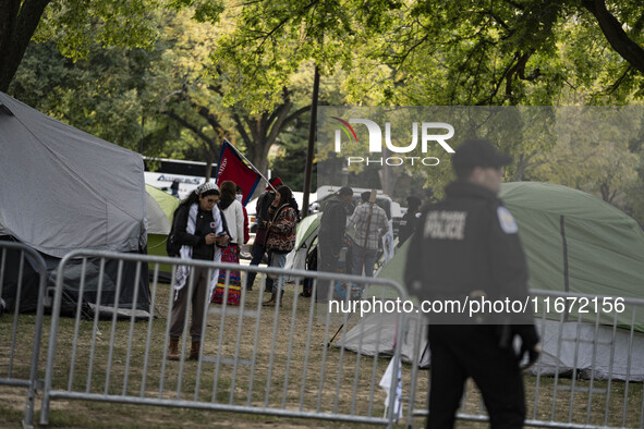 In Washington, DC, on October 14, an Indian tribe from San Francisco rides on horses and makes it to the National Mall, where they have been...