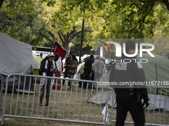 In Washington, DC, on October 14, an Indian tribe from San Francisco rides on horses and makes it to the National Mall, where they have been...