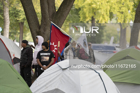 In Washington, DC, on October 14, an Indian tribe from San Francisco rides on horses and makes it to the National Mall, where they have been...