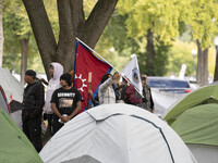 In Washington, DC, on October 14, an Indian tribe from San Francisco rides on horses and makes it to the National Mall, where they have been...