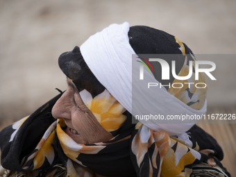 An Iranian nomadic woman smiles while participating in the 11th National Handicrafts and 3rd International Tourism Exhibition in the histori...