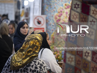 Iranian women visit the 11th National Handicrafts and 3rd International Tourism Exhibition in the historical city of Tabriz, located 624 km...