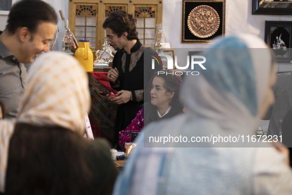 An Iranian female artist sits at her stand during the 11th National Handicrafts and 3rd International Tourism Exhibition in the historical c...