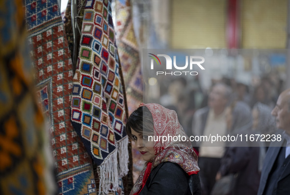 An Iranian woman visits the 11th National Handicrafts and 3rd International Tourism Exhibition in the historical city of Tabriz, located 624...