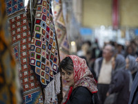 An Iranian woman visits the 11th National Handicrafts and 3rd International Tourism Exhibition in the historical city of Tabriz, located 624...