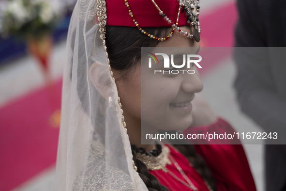 A young Iranian girl wears Turkish traditional dresses while participating in the 11th National Handicrafts and 3rd International Tourism Ex...