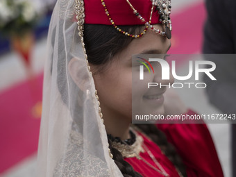 A young Iranian girl wears Turkish traditional dresses while participating in the 11th National Handicrafts and 3rd International Tourism Ex...